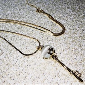 Goldtone necklace with key pendant